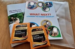 Cover of booklet for parents with teabags to the side